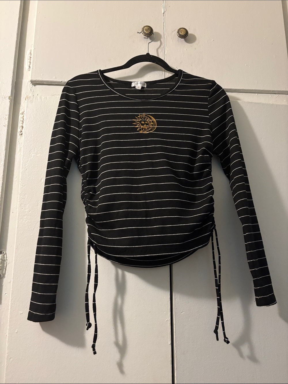 Black Striped Long-Sleeve Cinch Top with Gold Sun Accent